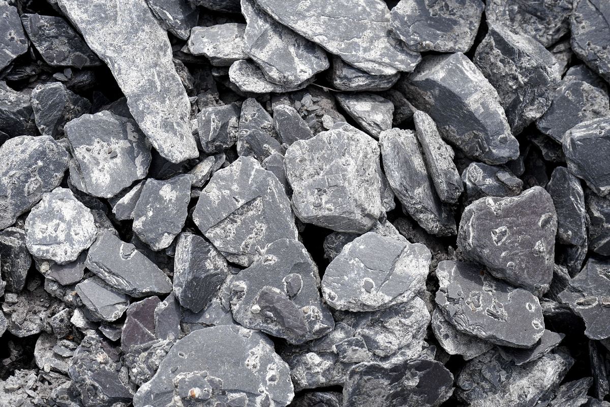 Pile of dark gray split slate stone